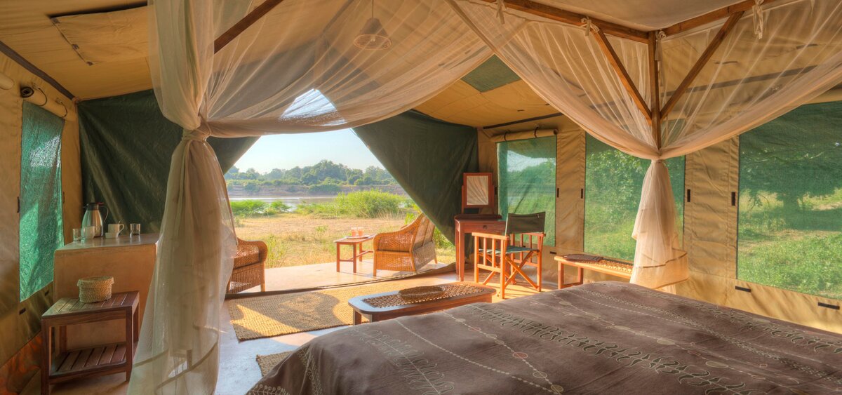Safari sundowner overlooking the savannah at sunset